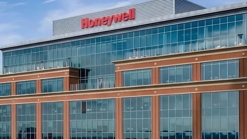 Honeywell headquarters exterior with red corporate logo mounted above a multi-storey glass and brick facade